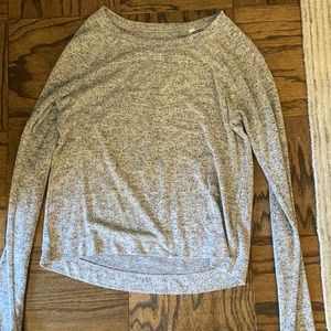 Grey sweater with some black and white coloring.